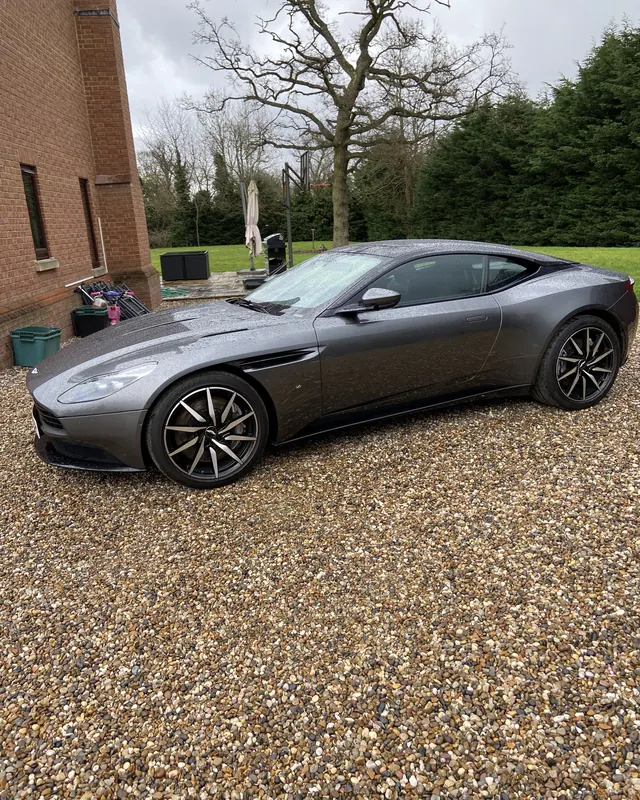 Aston Martin DB11 on a gravel drive, a 30th birthday surprise