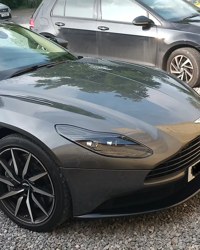 Aston Martin DB11 Volante on a gravel drive