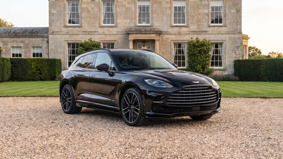 Aston Martin DBX 707 on the gravel drive of an English country house