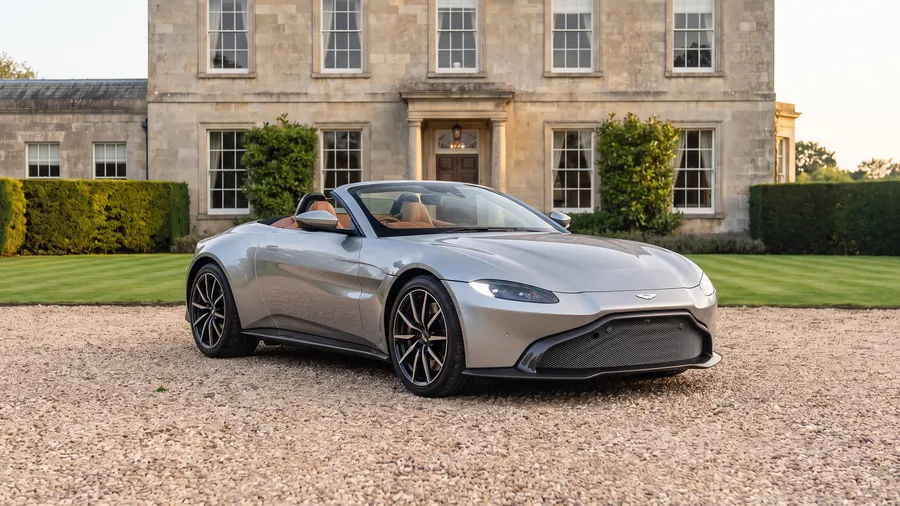 Aston Martin V8 Vantage Roadster on the gravel drive of an English country house