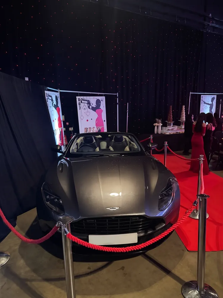 Aston Martin DB11 Volante on a red carpet at a corporate event