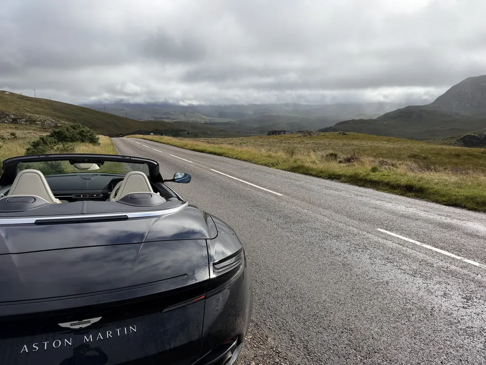 Aston Martin DB11 Volante on an open mountain road