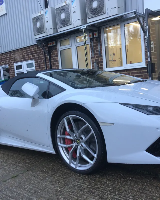 White Lamborghini Huracán Spyder outside an office