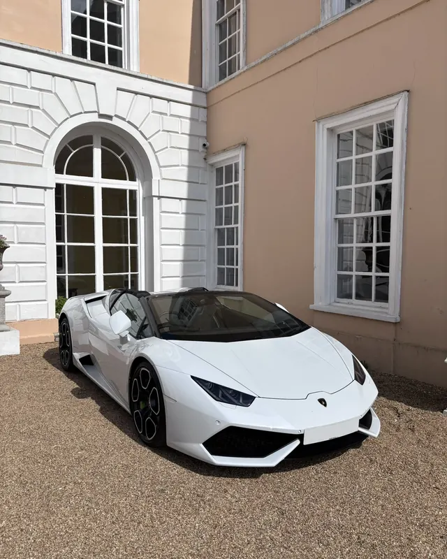 White Lamborghini Huracán Spyder outside a house, hired for a 30th birthday