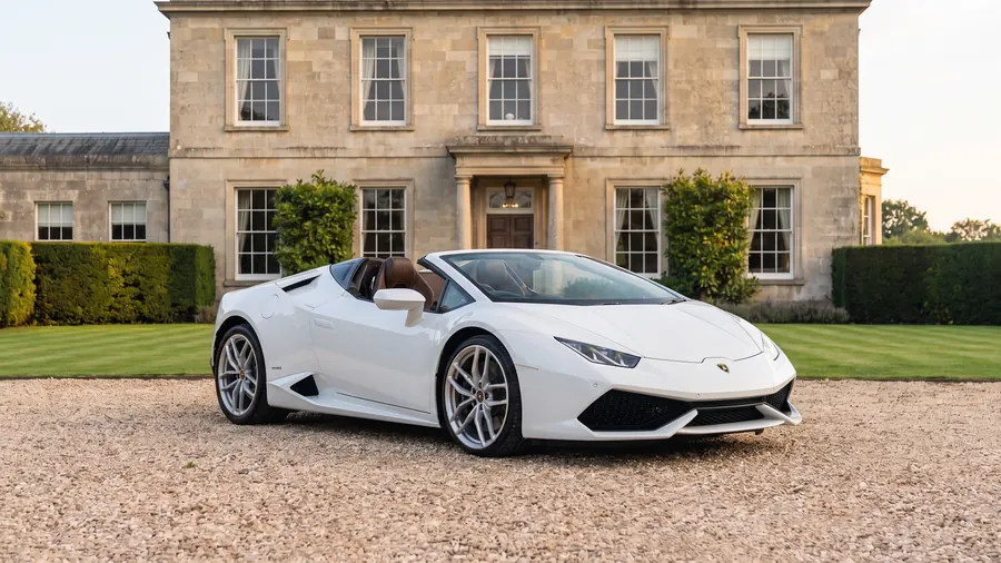 Lamborghini Huracán Spyder on the gravel drive of an English country house