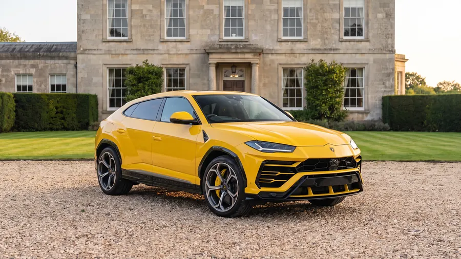 Lamborghini Urus on the gravel drive of an English country house