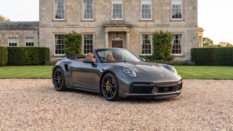 Porsche 911 Turbo S Cabriolet on the gravel drive of an English country house