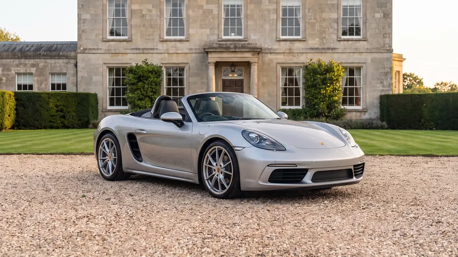 Porsche Boxster on the gravel drive of an English country house