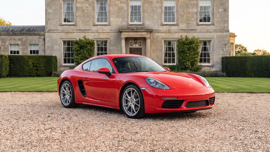 Porsche Cayman on the gravel drive of an English country house