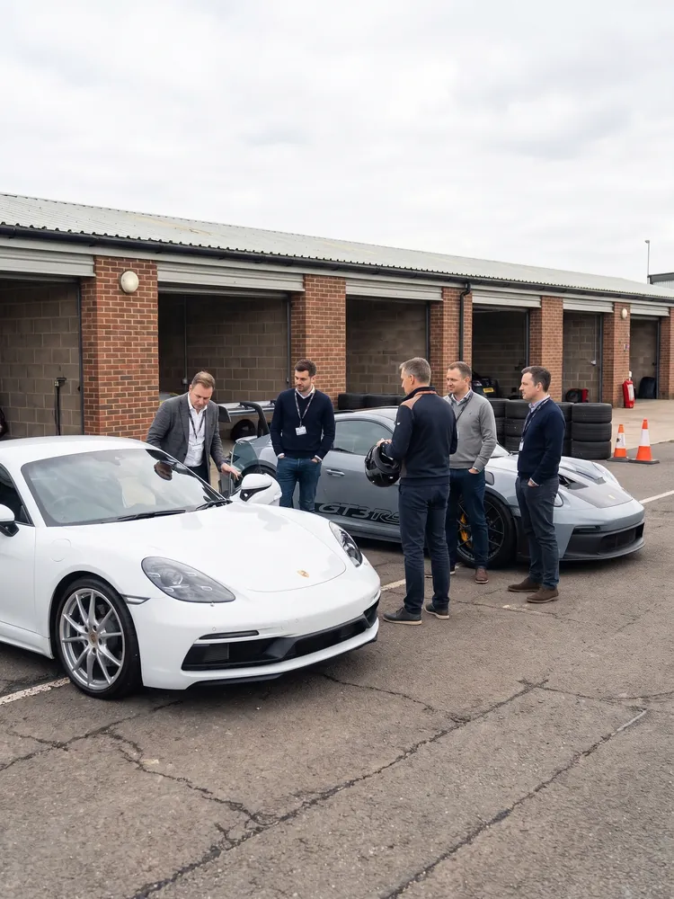A Porsche Cayman and 911 GT3 RS at a corporate track day